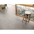 Helsinki 1841 Blanco Decor Garden patterned porcelain tiles with a wooden stool