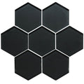 Hera metallic hexagon mosaics featuring black hexagonal glass tiles with glossy finish and white grout lines