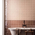 Beige and rose-toned glossy ceramic hessian torus moulding tiles with subtle textured finish for decorative use