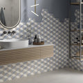 Hexagon blue cube hexagonal mosaic tiles in light gray medium gray and white create a modern bathroom backsplash