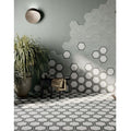 Hexagon white framed wall tiles with black outlines in a modern hexagonal pattern on white and gray surfaces