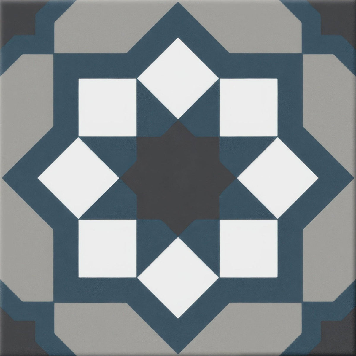 Hidra capri cold matt 20 x 20cm blue and white geometric patterned ceramic tile with central dark starburst design
