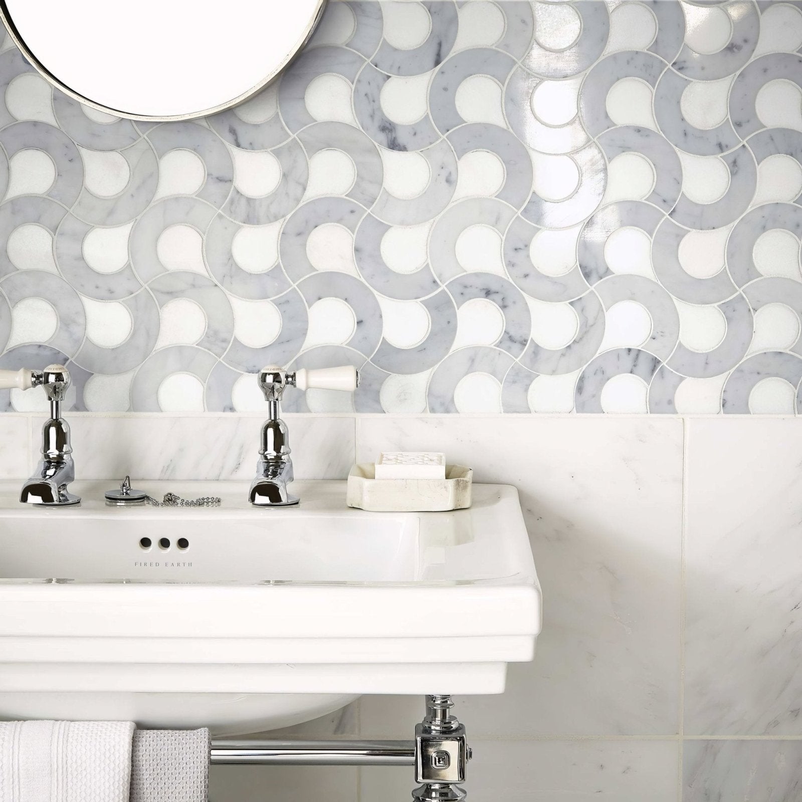 High society marble guggenheim white marble sink with chrome faucets and matching towel rack beneath