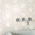 High Society Marble Rockefeller white marble mosaic with a chrome wall-mounted tap
