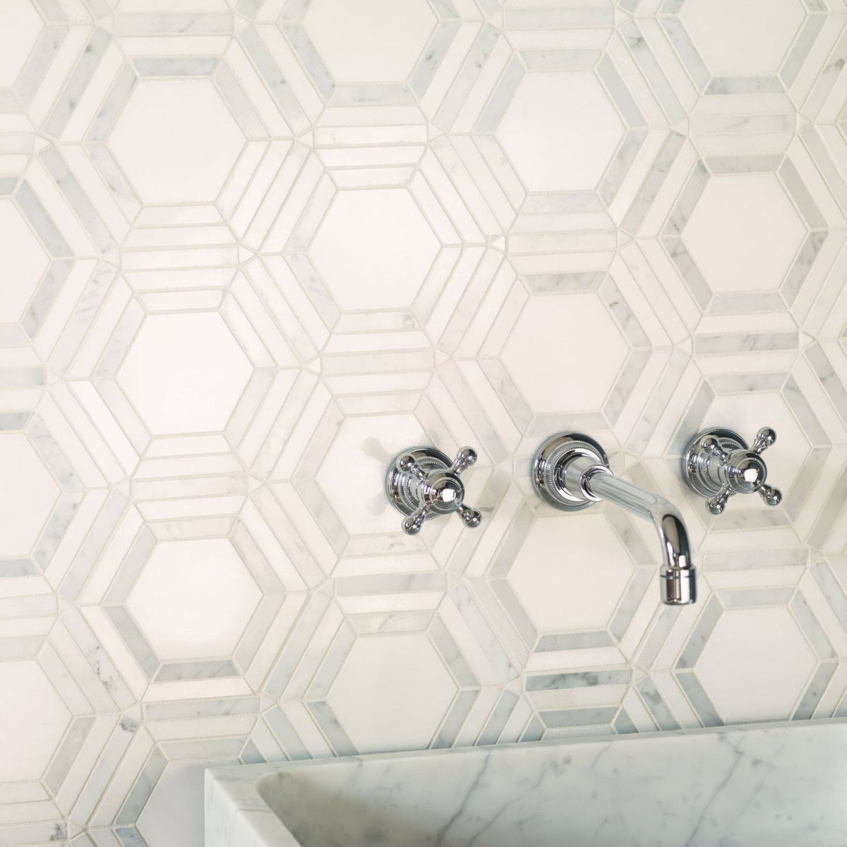 High Society Marble Rockefeller white marble mosaic with a chrome wall-mounted tap