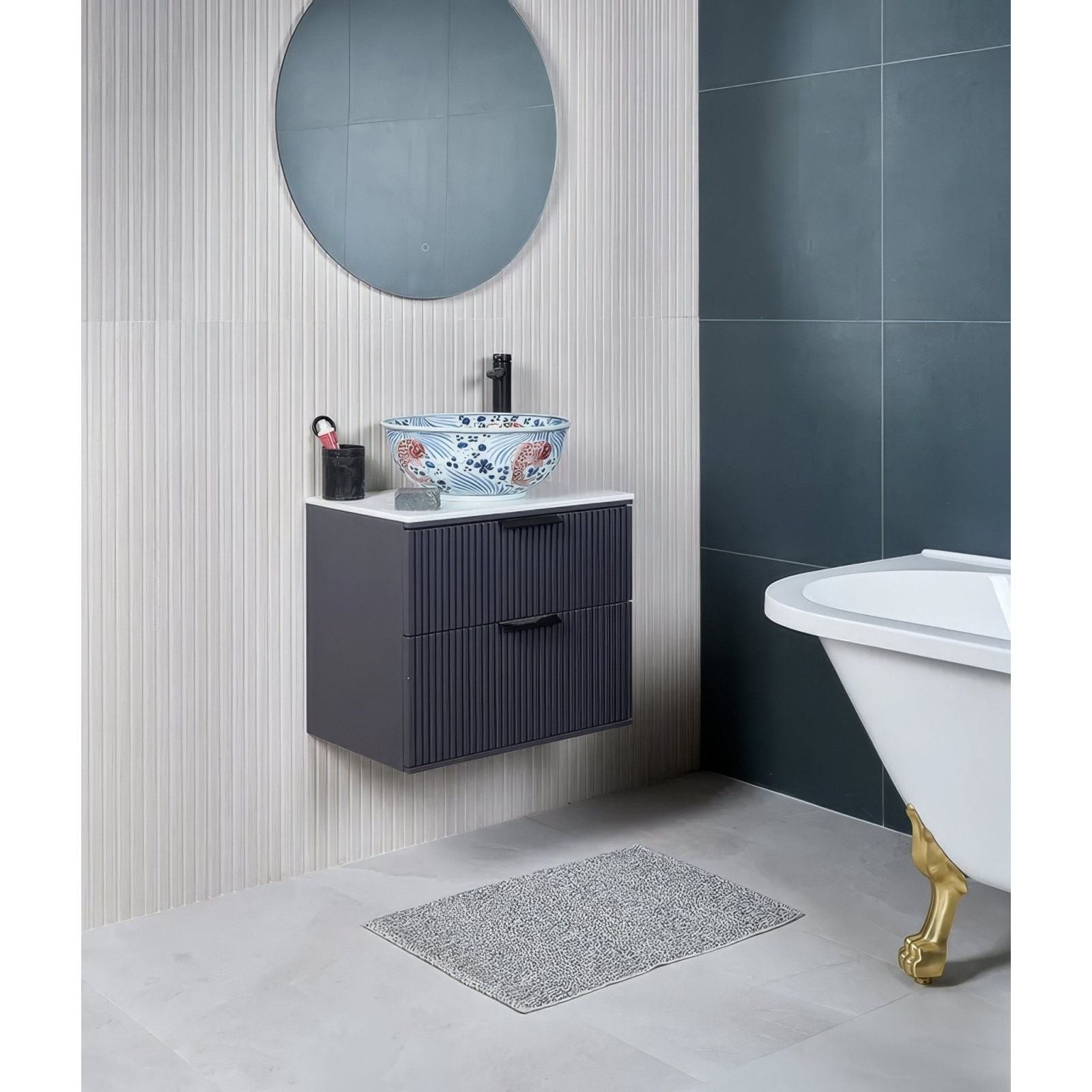 Blue and white floral porcelain matt crystal ceramic bowl sink with black faucet on dark gray ribbed vanity cabinet