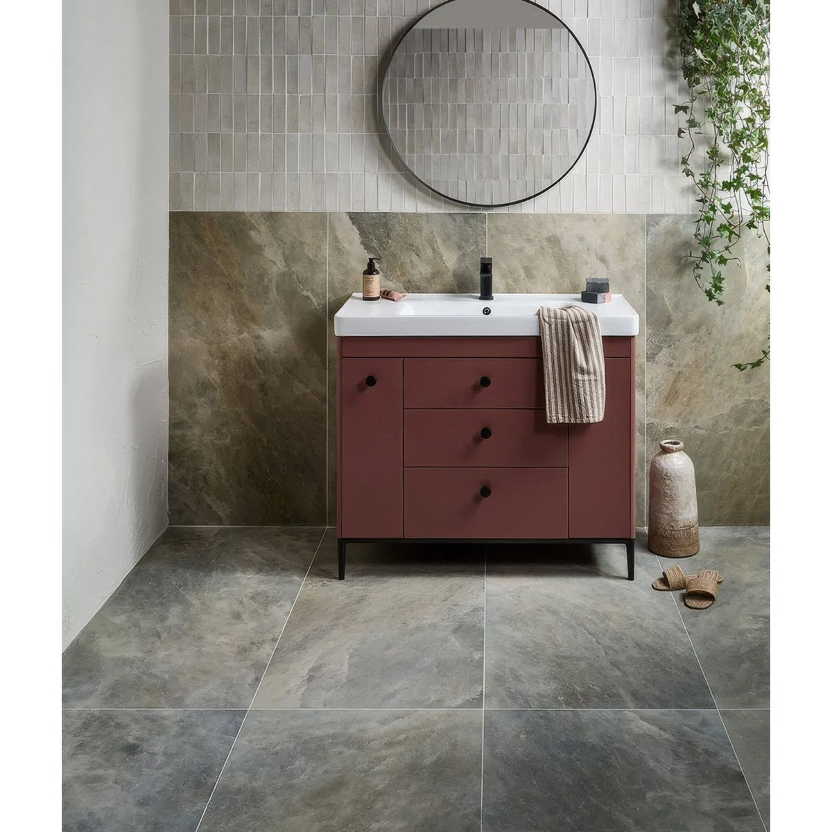 Himalaya Porcelain Matt Fjord beige marble-effect tiles with a rust-coloured vanity and round mirror