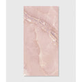 A rectangular pink marble hollywood porcelain rose tile with subtle veining and a smooth polished surface