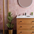 Hollywood Porcelain Rose pink marble-effect tiles with a wooden ribbed-drawer vanity