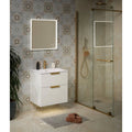 Hollywood Porcelain Sand cream marble-effect tiles with a wall-mounted vanity and illuminated mirror