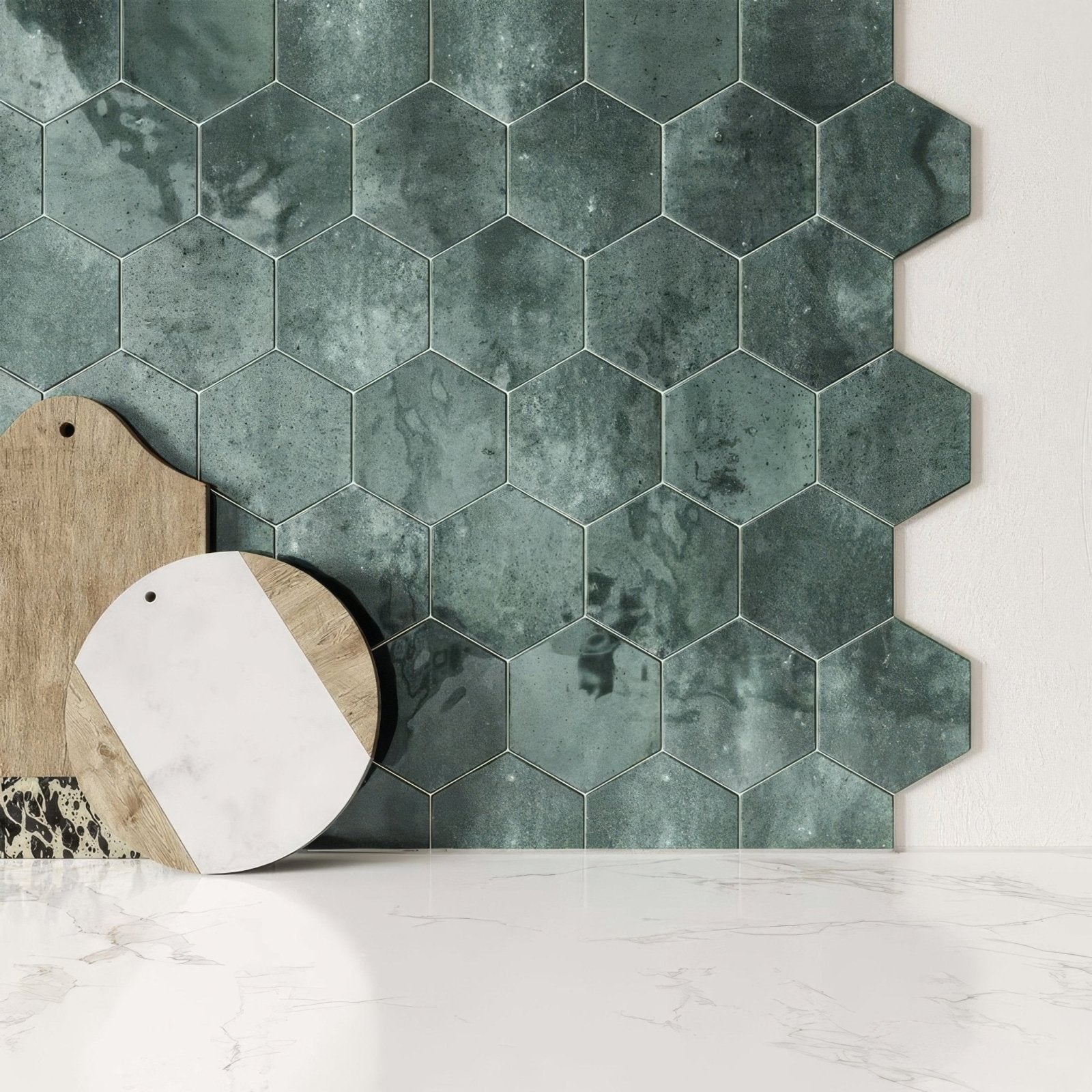 Dark green hexagon gloss ceramic wall tiles with marbled matte finish forming a decorative wall surface