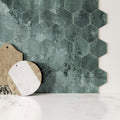 Dark green hexagon gloss ceramic wall tiles with marbled matte finish forming a decorative wall surface