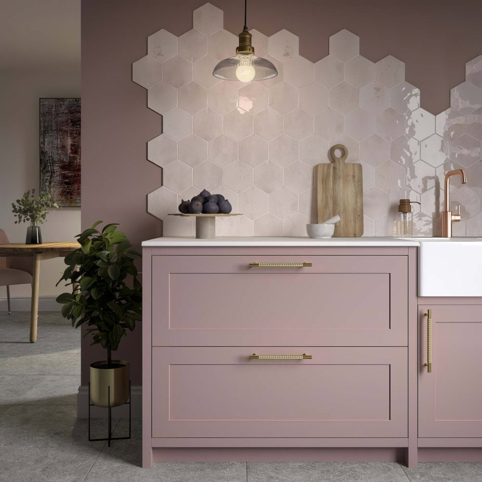 Pastel pink hope rose hexagon gloss ceramic wall tiles with gold-tone bar handles and white countertop background