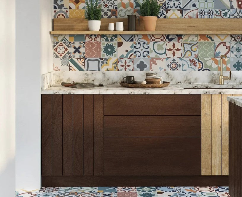 Patterned encaustic-look floor and wall tiles in a kitchen with dark timber cabinets