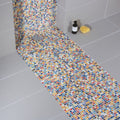 Vibrant ibiza porcelain mosaic shower floor with multicolored small square tiles in yellow blue red and white