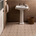 Ickworth Artisan Skirting beige skirting tiles with a pedestal sink and black handles