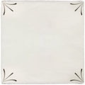 Cream-colored ceramic tile imprint delft corners with black leaf-like motifs at each corner for decorative use