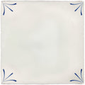 Cream-colored ceramic tile with delicate blue floral motifs in each corner from imprint delft corners collection