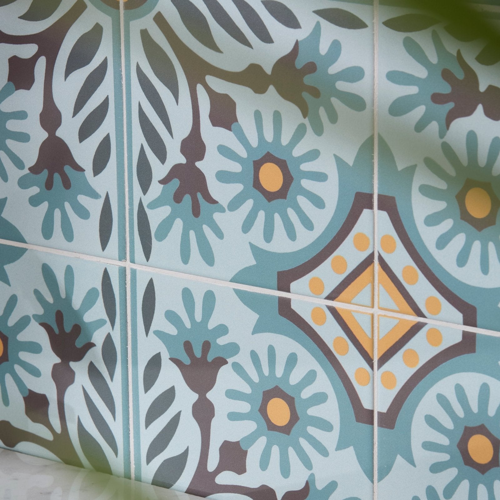 Patterned indirah porcelain azure ceramic tiles with light blue brown and yellow floral design 20 x 20 cm