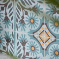 Patterned indirah porcelain azure ceramic tiles with light blue brown and yellow floral design 20 x 20 cm