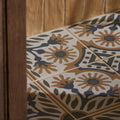 Patterned indirah porcelain cotto floor tiles with intricate cream brown and dark blue floral and geometric designs 20 x 20cm
