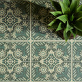 Green and cream patterned Indirah porcelain floor tiles with sunburst and leaf motifs 20 x 20 cm