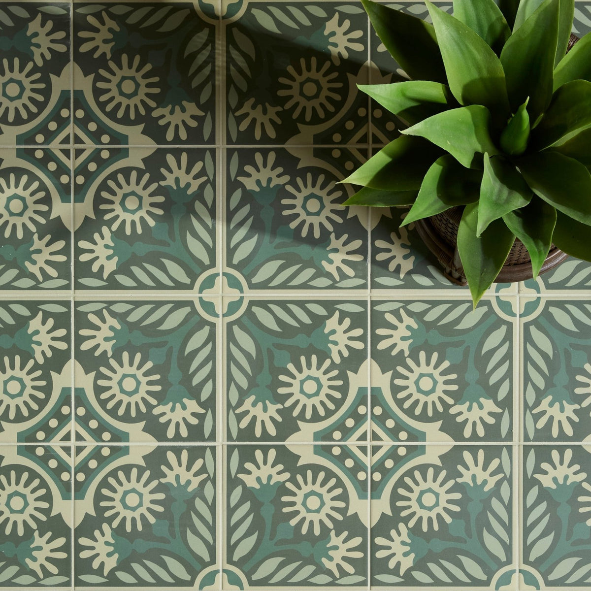 Green and cream patterned Indirah porcelain floor tiles with sunburst and leaf motifs 20 x 20 cm