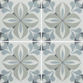 Gray and white floral-patterned ceramic floor tiles with vintage-inspired infusion lousa patterned tile design