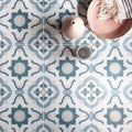 Infusion nazare patterned tile featuring blue and white ceramic floor tiles with a floral design