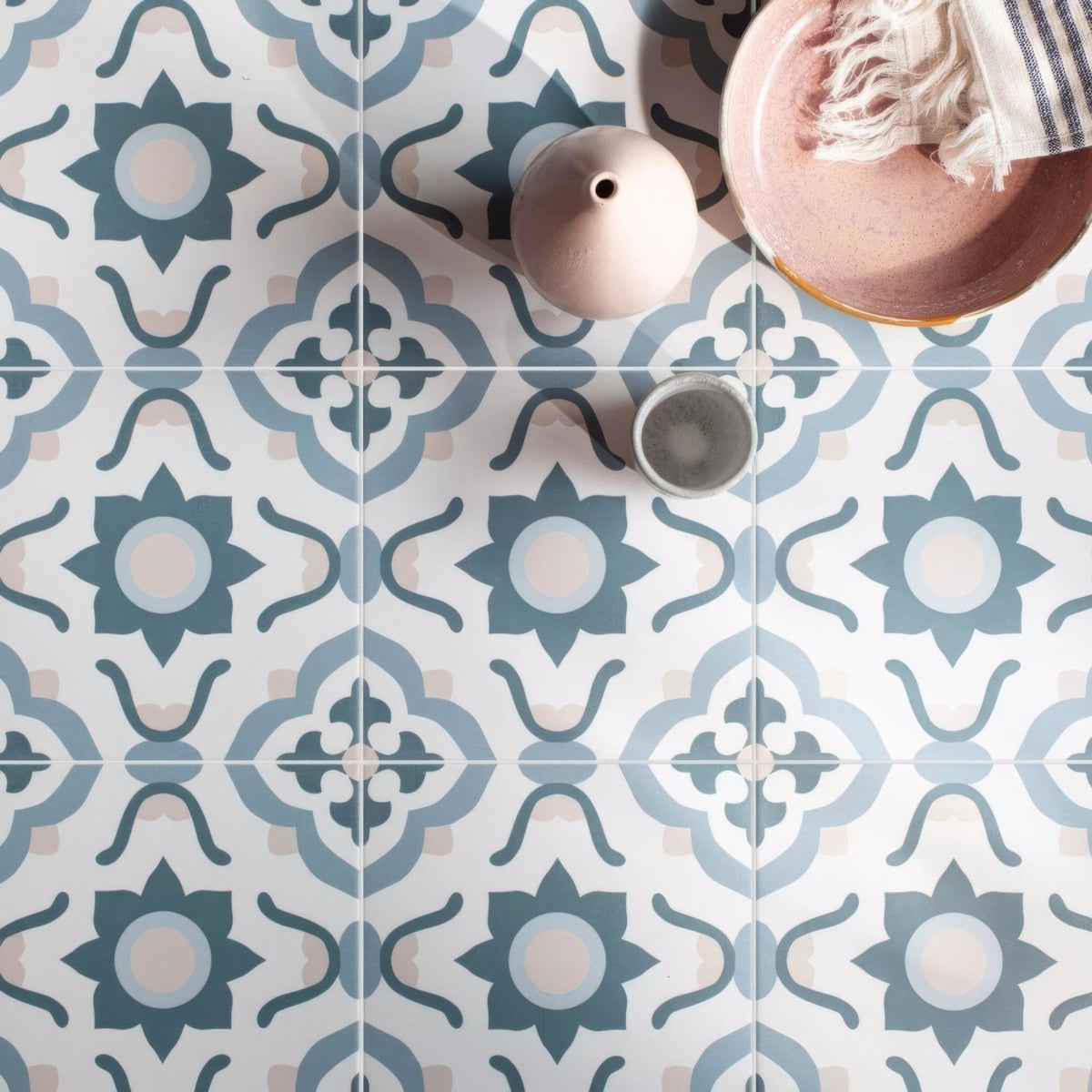 Infusion nazare patterned tile featuring blue and white ceramic floor tiles with a floral design