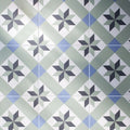 Infusion Ribeira patterned ceramic floor tile with geometric star motifs in gray blue and white colors