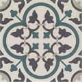 A square ceramic infusion st etienne patterned tile with symmetrical dark gray and teal quatrefoil leaf design on off-white