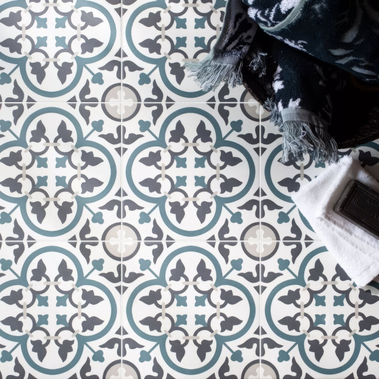 Blue and gray patterned ceramic floor tiles with vintage ornate design from infusion st etienne collection