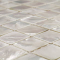 Square iridescent white mother-of-pearl mosaic tiles with a glossy finish from Innocence 25mm square collection