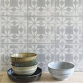 Stack of earth-toned ceramic bowls with subtle glaze and textured rims inspired by istria ravni patterned tile design