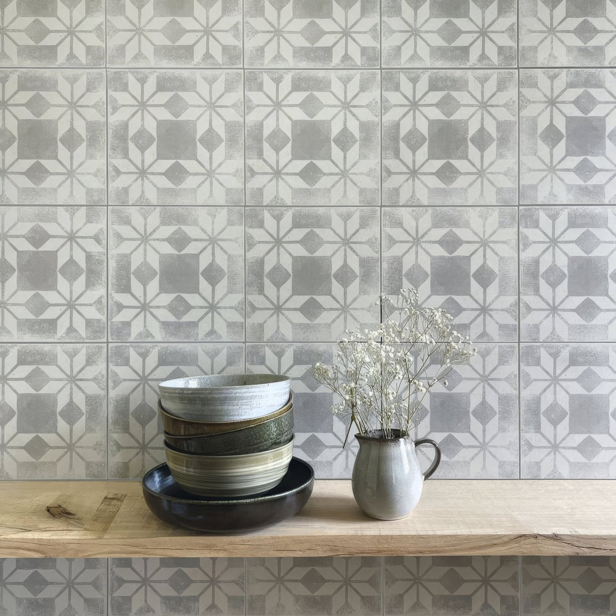Stack of ceramic bowls in muted earth tones with subtle glaze finish inspired by istria ravni patterned tile design