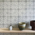 Stack of ceramic bowls in earthy tones with subtle glaze finishes inspired by istria ravni patterned tile design