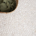 Ivory Samoa pebble mosaics featuring white textured natural stone floor tile with a smooth pebble pattern
