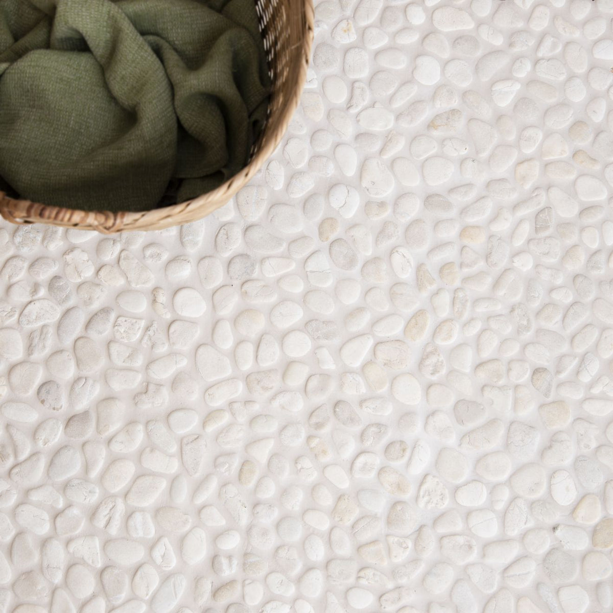Ivory Samoa pebble mosaics featuring white textured natural stone floor tile with a smooth pebble pattern