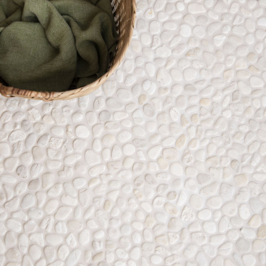 Ivory Samoa pebble mosaics featuring white textured natural stone floor tile with a smooth pebble pattern