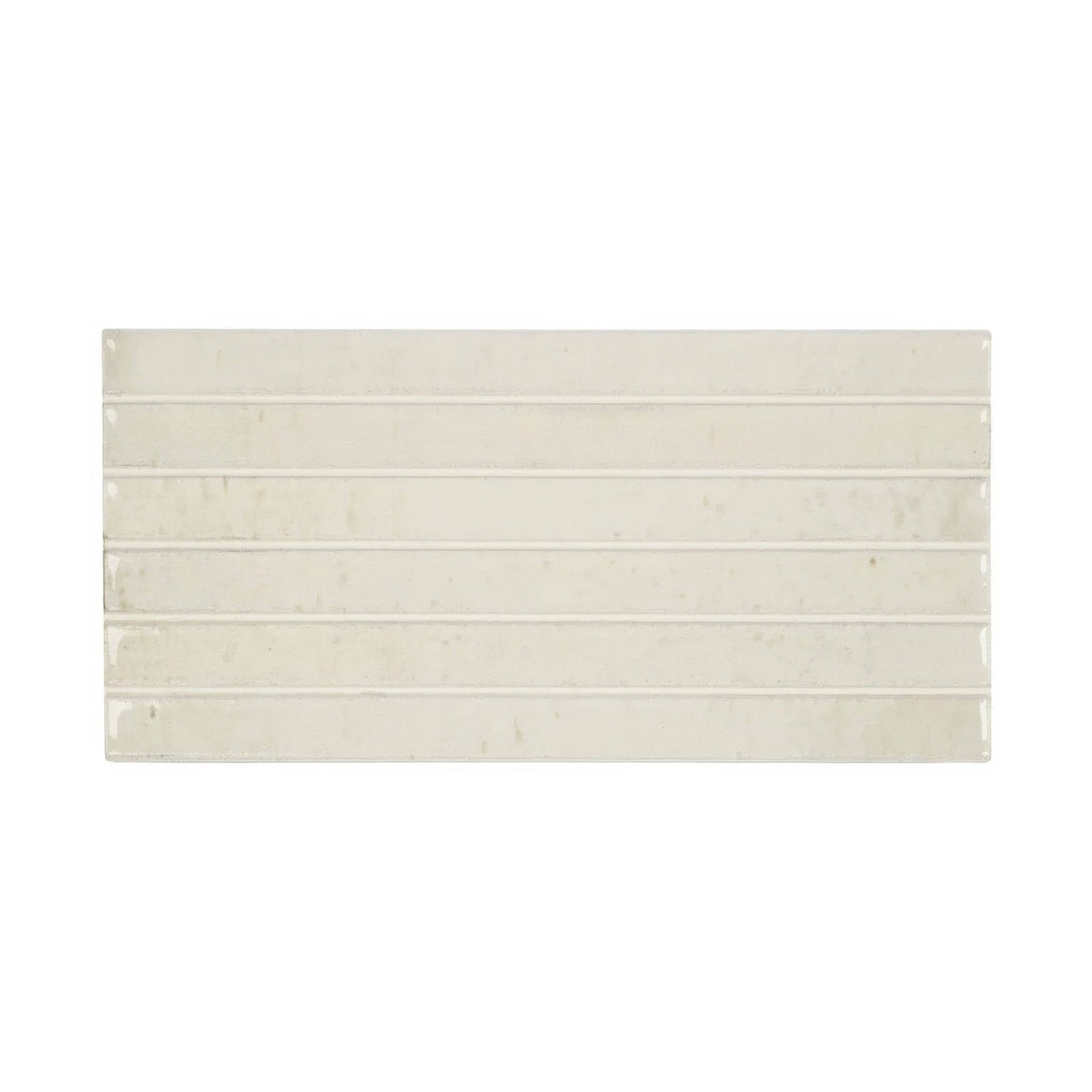 Cream-colored ixworth bone bar tile with subtle glossy finish and faint veining arranged in horizontal rectangular strips