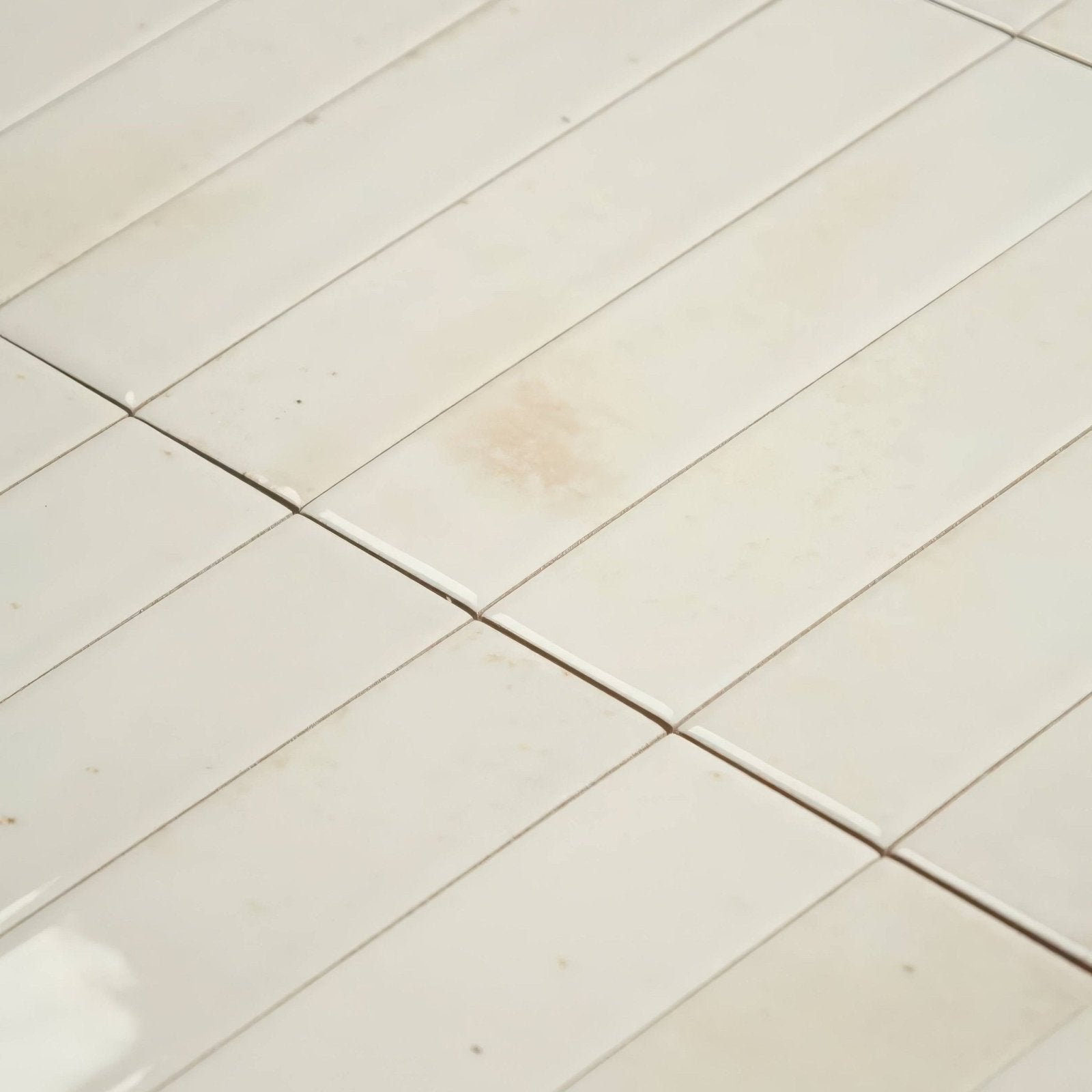 Off-white rectangular ceramic ixworth bone brick floor tiles with subtle grout lines for indoor flooring
