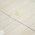 Off-white rectangular ceramic ixworth bone brick floor tiles with subtle grout lines for indoor flooring