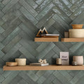 Ixworth forest brick tile wall featuring textured slate gray ceramic tiles arranged in a herringbone pattern