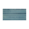 A rectangular ceramic Ixworth Sky Bar tile with a matte muted teal glaze and subtle horizontal ridges