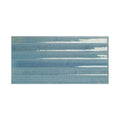 A rectangular ceramic Ixworth Sky Bar tile with glossy muted blue glaze and lighter horizontal brushstroke patterns