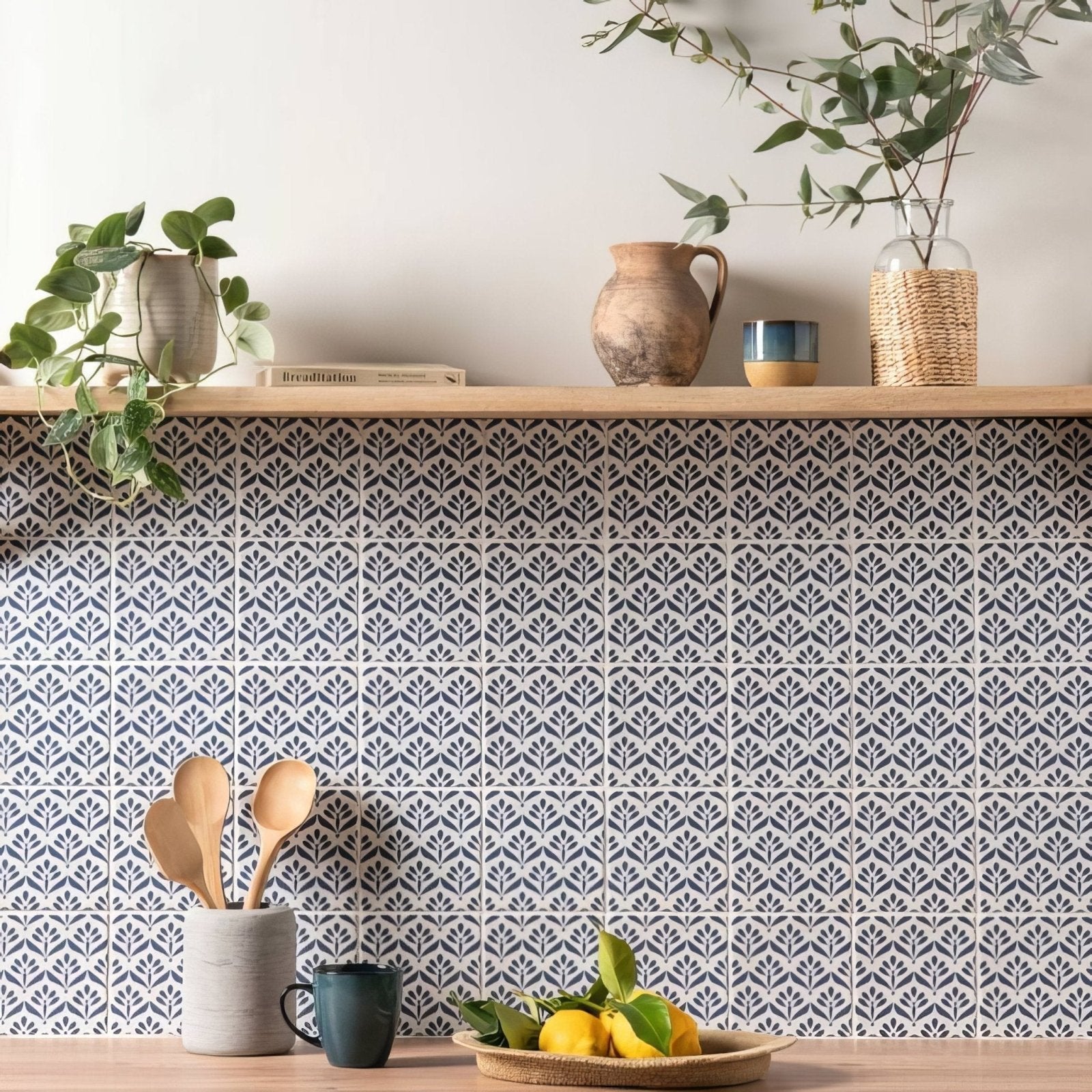 Gray and white leaf-patterned ceramic tile backsplash from Jacquard Indigo for stylish kitchen walls