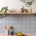 Gray and white leaf-patterned ceramic tile backsplash from Jacquard Indigo for stylish kitchen walls