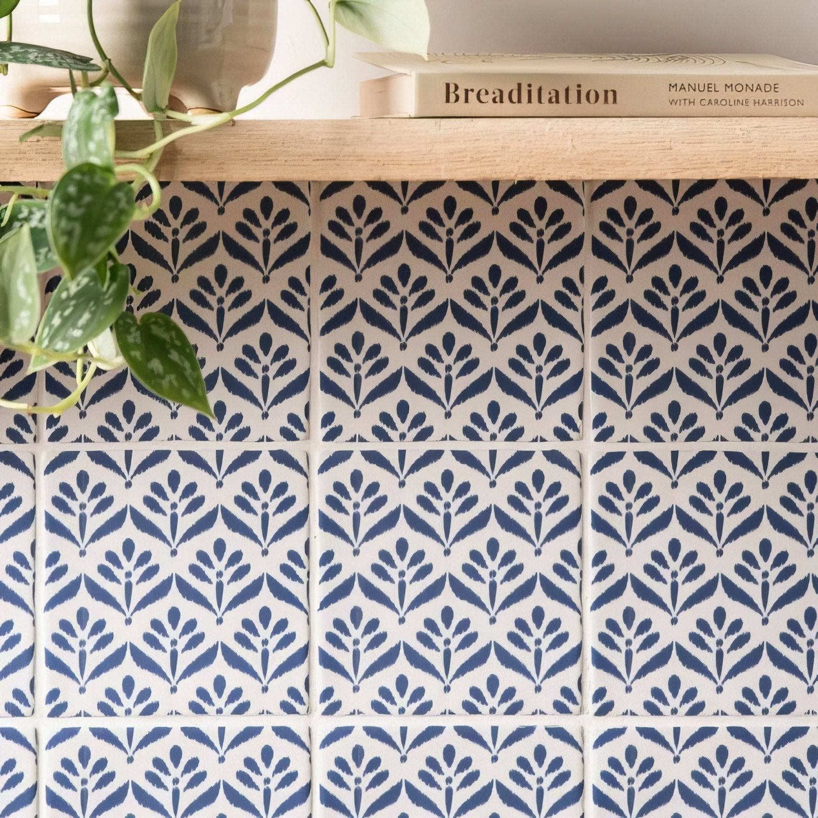 Blue and white patterned ceramic tiles with stylized leaf design from jacquard indigo collection