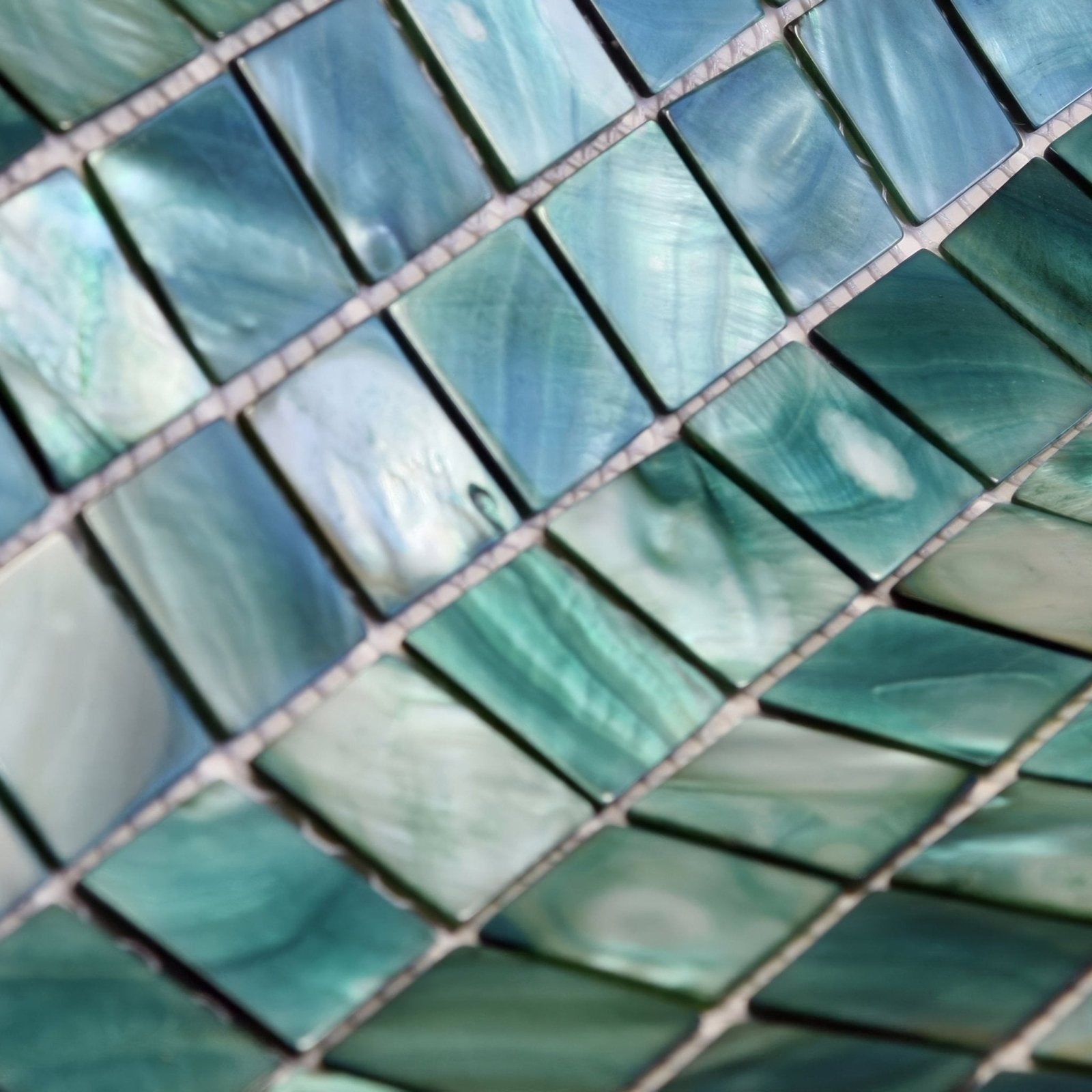 Jade 25mm square mosaic tiles with shimmering teal and green iridescent colors and a subtle pearlescent finish